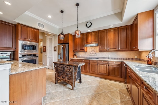 kitchen with light stone countertops, sink, appliances with stainless steel finishes, and tasteful backsplash