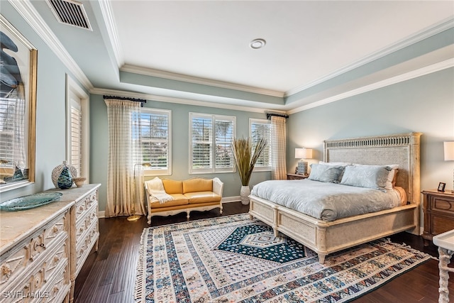 bedroom featuring crown molding and dark hardwood / wood-style flooring