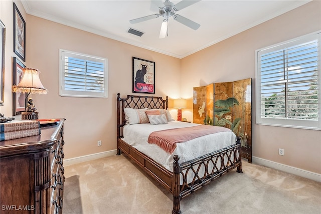 bedroom featuring ceiling fan, light carpet, and crown molding