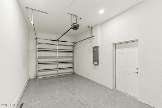 garage with electric panel and a garage door opener