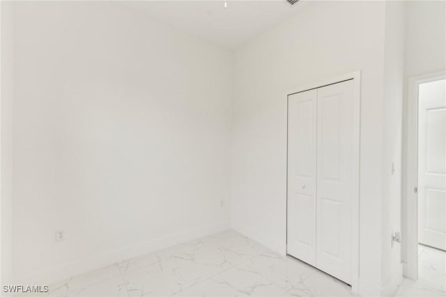 unfurnished bedroom featuring a closet