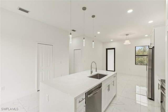 kitchen with white cabinetry, sink, pendant lighting, a kitchen island with sink, and appliances with stainless steel finishes