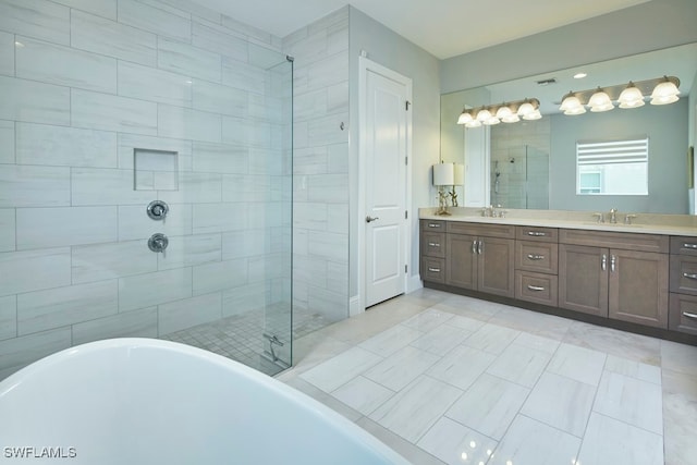 bathroom featuring vanity, separate shower and tub, and tile patterned floors