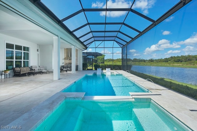 view of swimming pool featuring a water view, a patio, and a lanai