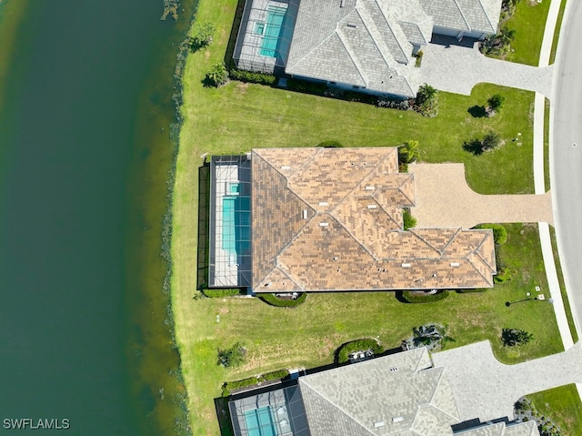 birds eye view of property with a water view