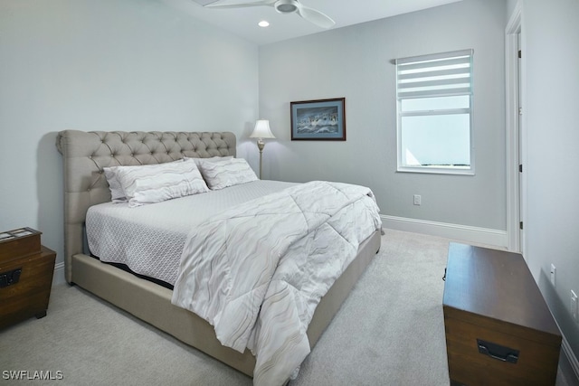 bedroom with light colored carpet and ceiling fan