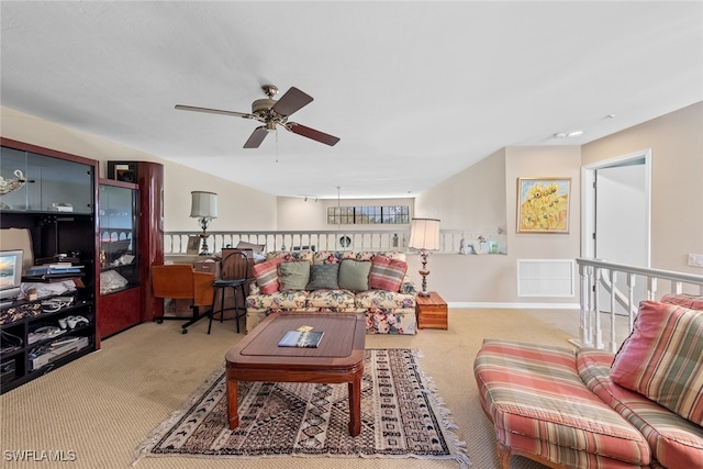 living room featuring light carpet and ceiling fan