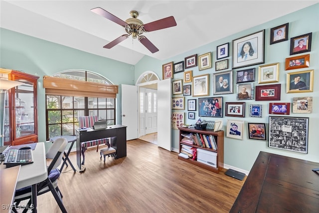 office area with lofted ceiling, hardwood / wood-style floors, and ceiling fan