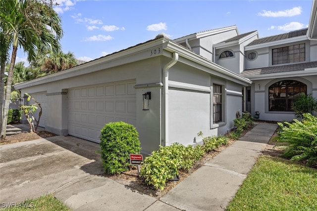 view of side of property featuring a garage