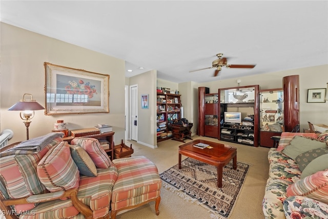 living room featuring light carpet and ceiling fan