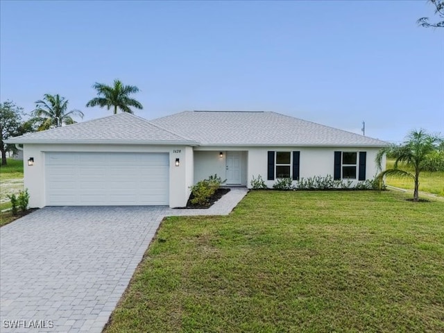 single story home with a garage and a front yard