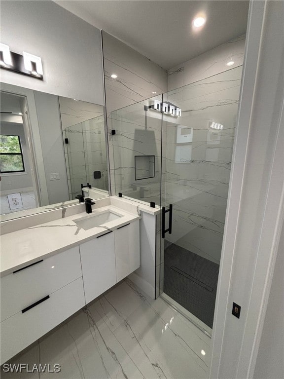 bathroom with vanity and an enclosed shower