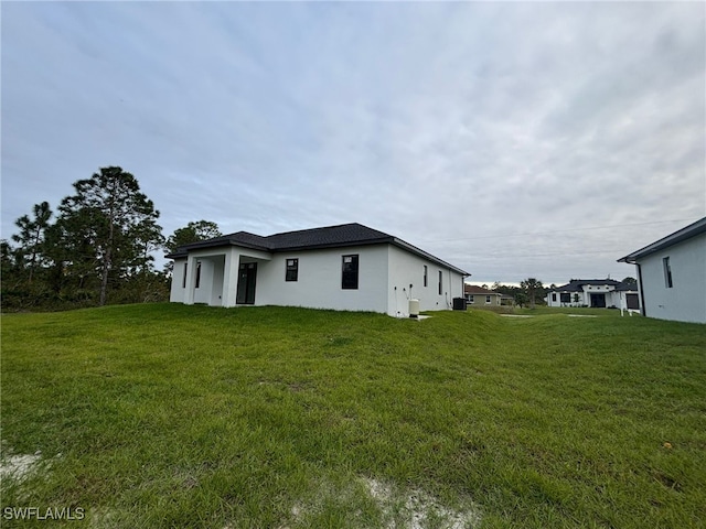 view of property exterior with a yard