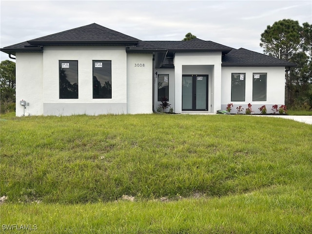 prairie-style home featuring a front yard