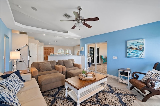 living room with lofted ceiling and ceiling fan