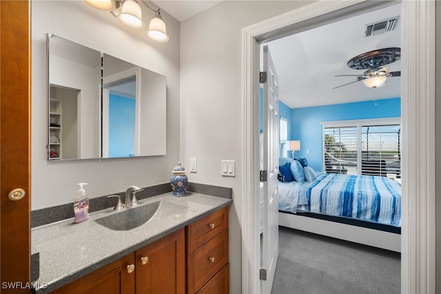 bathroom featuring vanity and ceiling fan