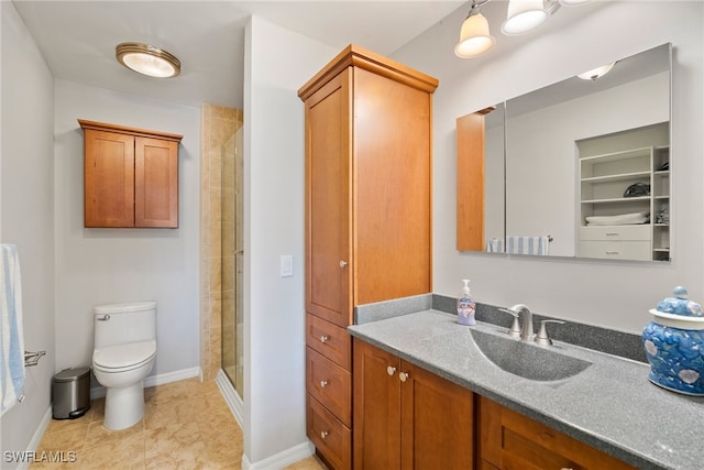 bathroom featuring vanity, tile patterned floors, toilet, and an enclosed shower