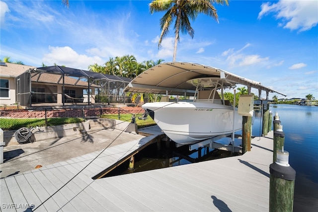 dock area with a water view and a lanai