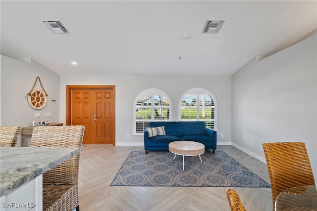 living area with light parquet flooring