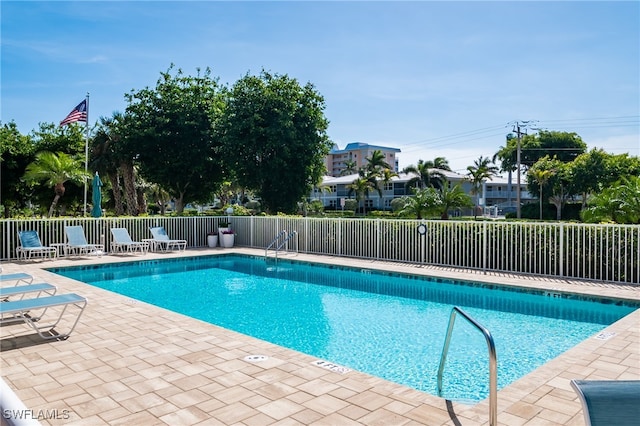 view of swimming pool featuring a patio area