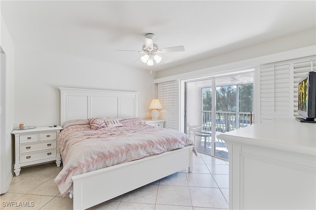 bedroom featuring access to outside, light tile patterned floors, and ceiling fan