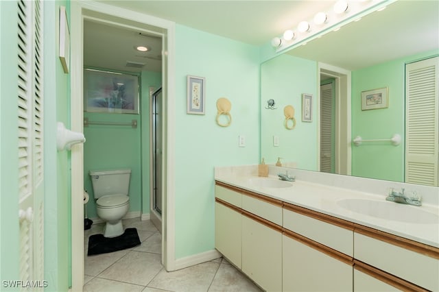 bathroom featuring walk in shower, tile patterned flooring, vanity, and toilet