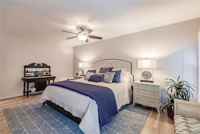 bedroom featuring dark hardwood / wood-style floors and ceiling fan