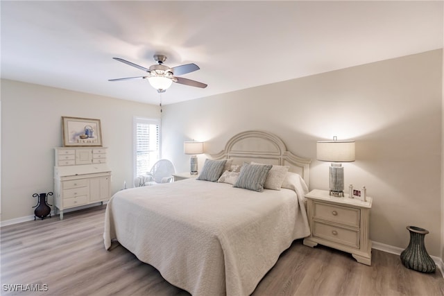 bedroom featuring ceiling fan and light wood-type flooring