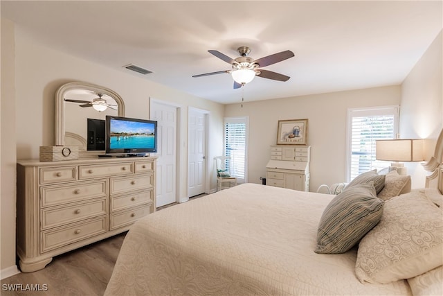 bedroom featuring hardwood / wood-style floors and ceiling fan