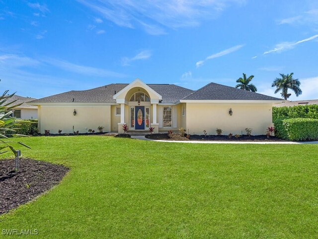 single story home with a front lawn