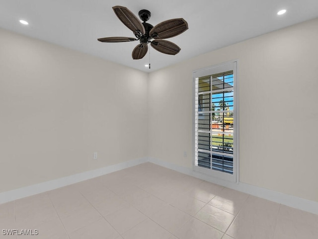 unfurnished room featuring light tile patterned flooring and ceiling fan