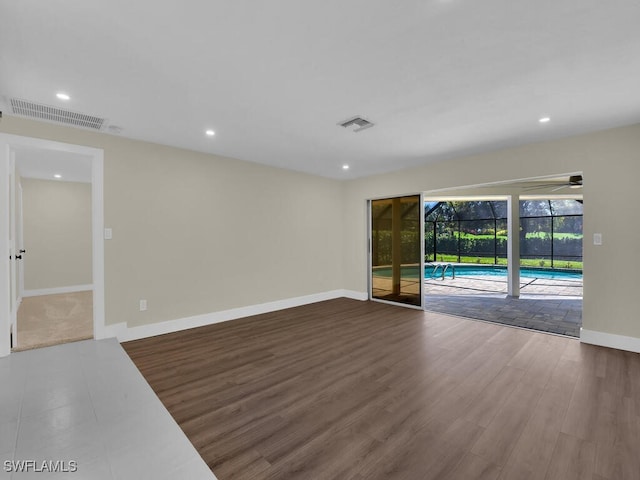 empty room featuring wood-type flooring