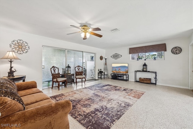 living room featuring ceiling fan