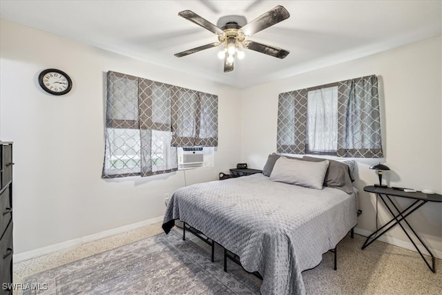 bedroom featuring cooling unit and ceiling fan