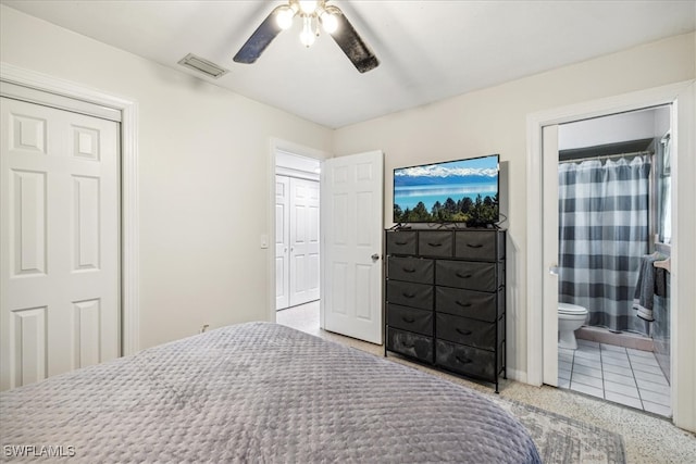 bedroom with ensuite bath and ceiling fan