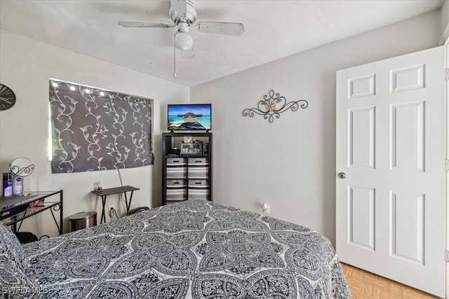 bedroom featuring parquet floors and ceiling fan