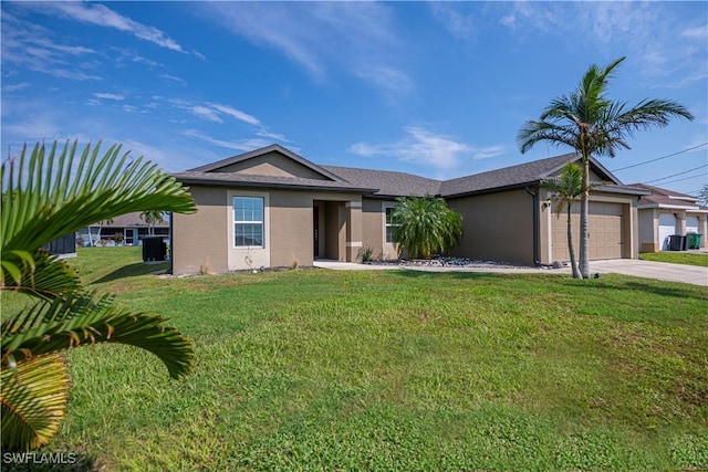 ranch-style house featuring a front yard and a garage