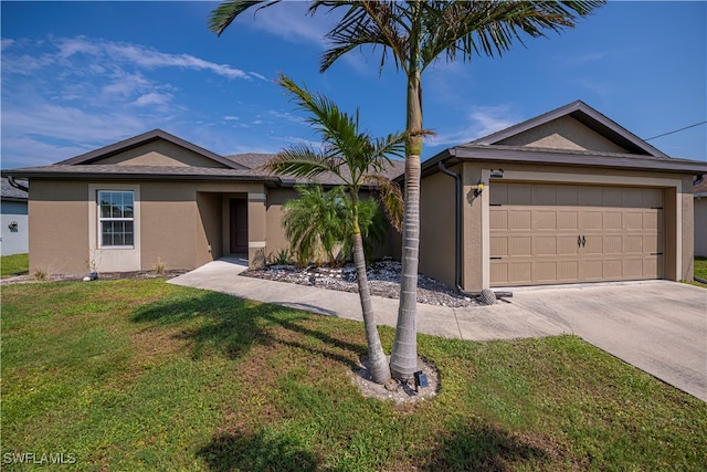 ranch-style home with a garage and a front yard