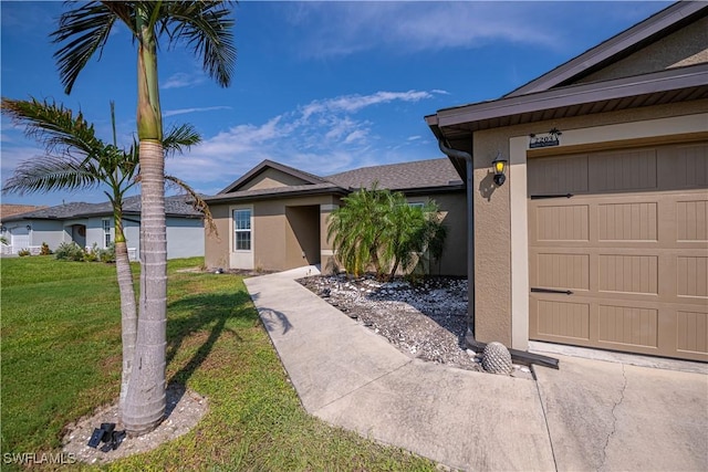 single story home featuring a front yard and a garage