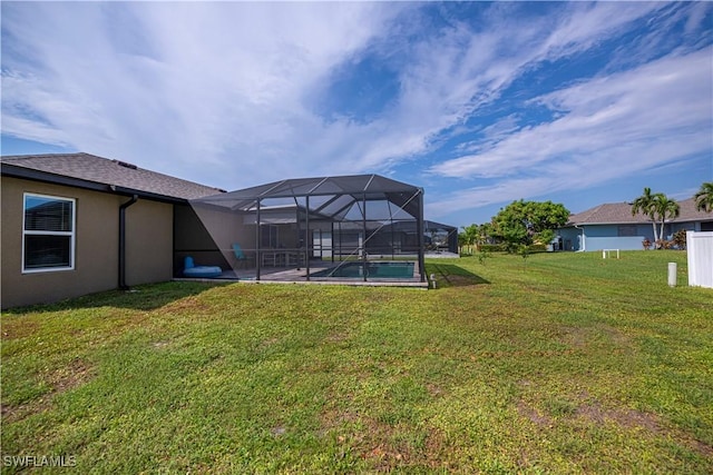 view of yard featuring glass enclosure