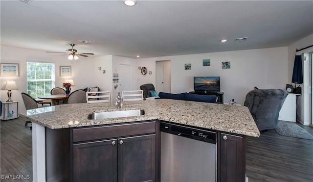 kitchen with stainless steel dishwasher, dark brown cabinets, dark hardwood / wood-style floors, and sink