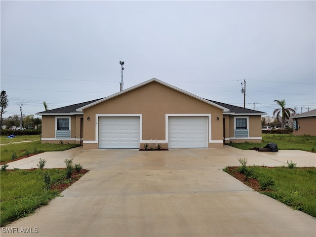 single story home featuring a garage