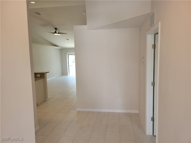 corridor featuring lofted ceiling