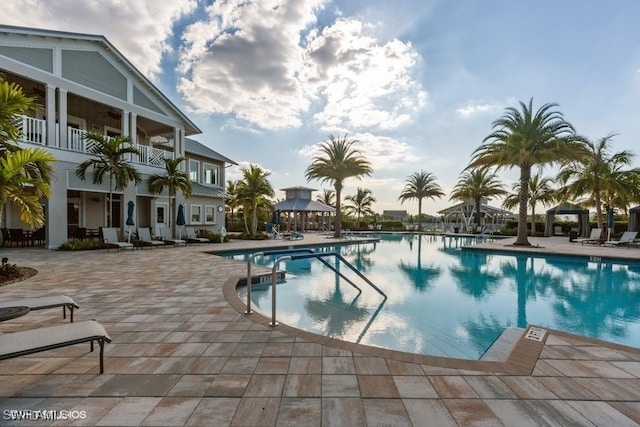 view of swimming pool featuring a patio and a gazebo