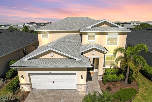 view of front of property with a garage