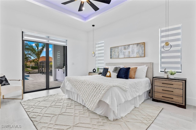 bedroom featuring ceiling fan and access to outside