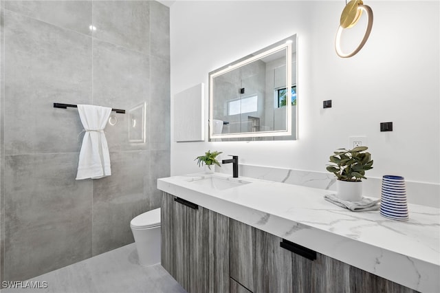 bathroom featuring toilet and vanity