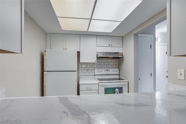 kitchen with tasteful backsplash, white appliances, exhaust hood, and white cabinetry