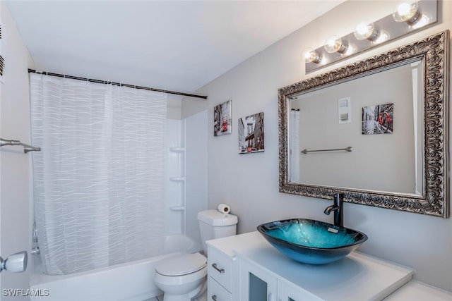 full bathroom featuring shower / bath combination with curtain, toilet, and vanity