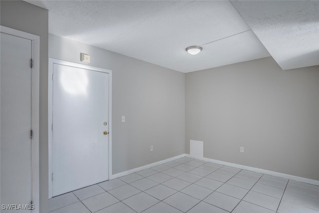 empty room with light tile patterned floors